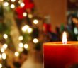 Photo of a Christmas tree and burning candle