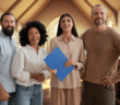 Smiling church staff posing together in a church sanctuary