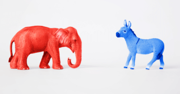 Red elephant and blue donkey facing each other