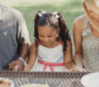 People dining at a picnic table