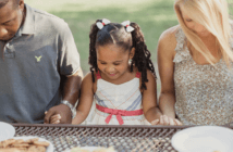 People dining at a picnic table