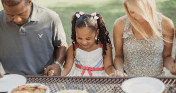 People dining at a picnic table