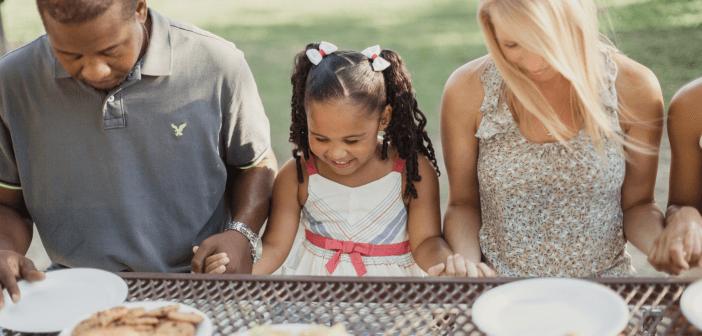 People dining at a picnic table