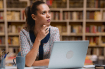 Pastor in front of a computer trying to think of what to write