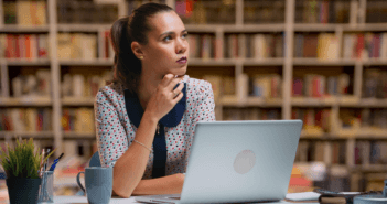 Pastor in front of a computer trying to think of what to write